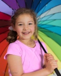 Photo of girl with a rainbow umbrella